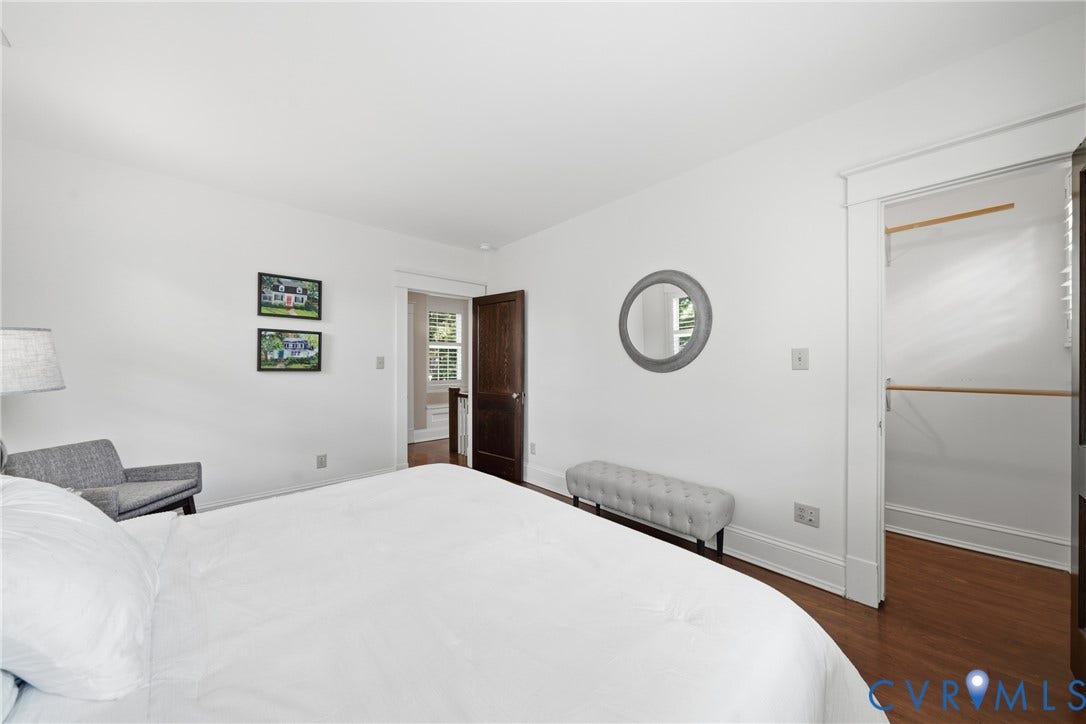 1500 Avondale Avenue, Bellevue, Richmond, VA 23227 Bright white wall finishes, wood-finish flooring, dark wood door, and an open closet