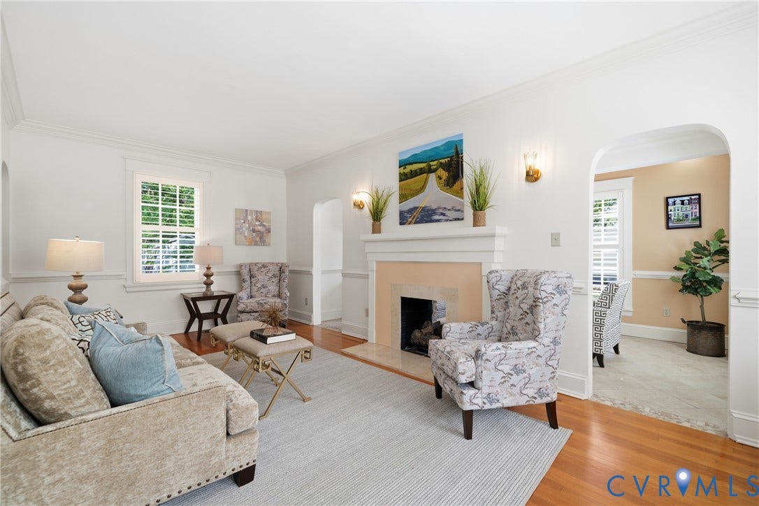 1500 Avondale Avenue, Bellevue, Richmond, VA 23227 Hardwood flooring, arched doorway, fireplace with mantel, wall sconces, and crown molding