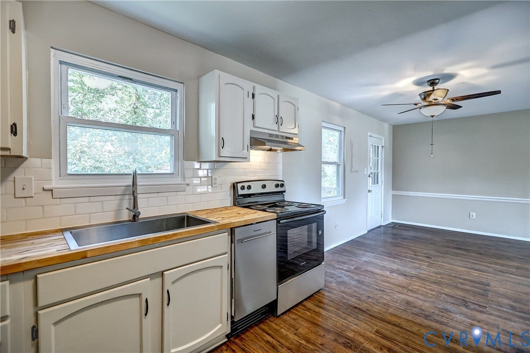 6100 Meadwood Circle, Hopkins Rd Corridor, Richmond, VA 23234 Contemporary kitchen featuring wood-finish countertops, stainless steel appliances, and white subway tile backsplash