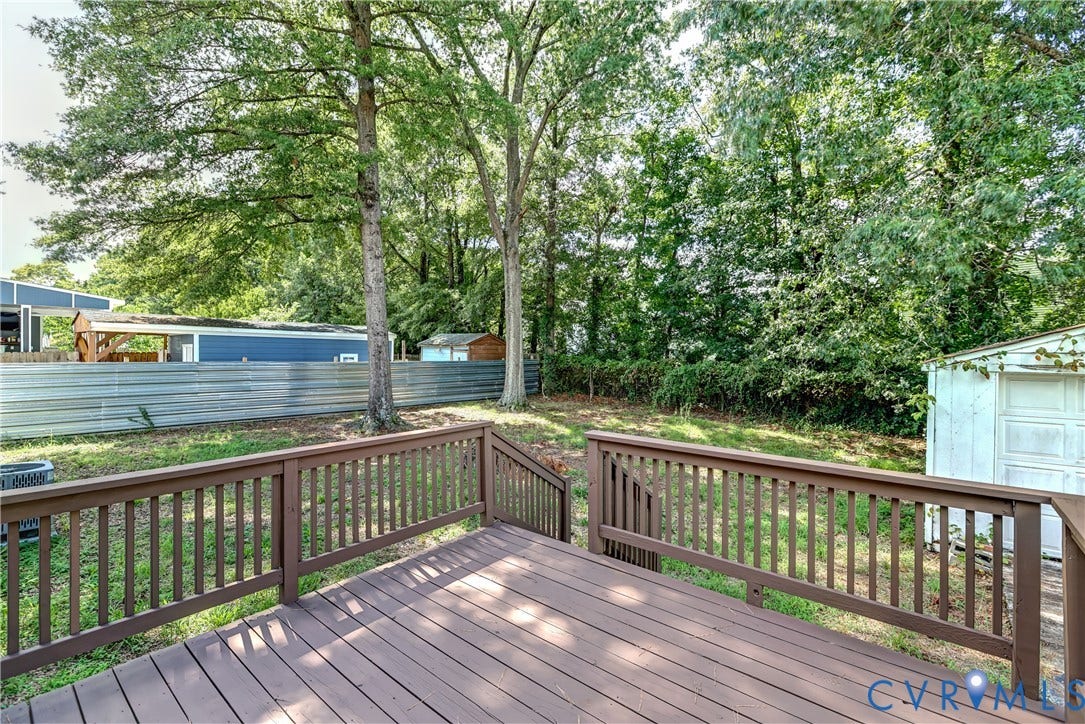 6100 Meadwood Circle, Hopkins Rd Corridor, Richmond, VA 23234 Wood-finish deck with matching railing, offering an elevated outdoor space. Can you believe a back yard like this in this price range??