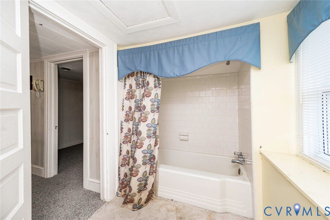 4912 Water View Road, Water View, Jamaica, VA 23180 Bathtub with white subway tile surround and chrome fixtures