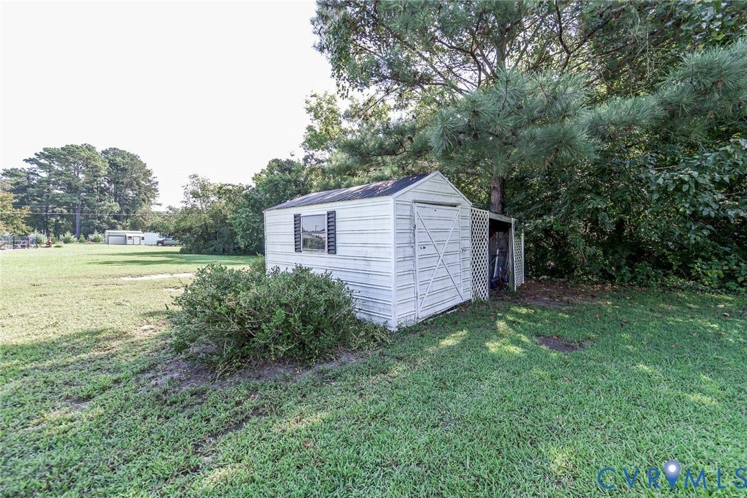4912 Water View Road, Water View, Jamaica, VA 23180 Storage shed with a single window and black louvered shutters