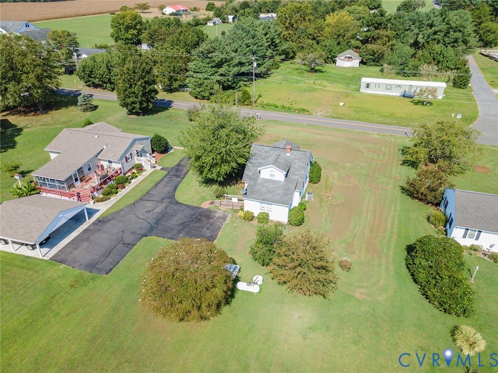 4912 Water View Road, Water View, Jamaica, VA 23180 Expansive property featuring two distinct structures, a paved drive, and mature trees
