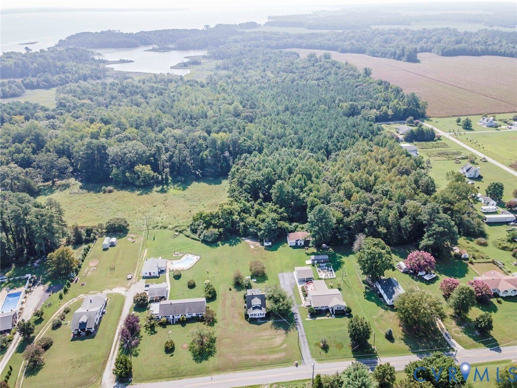 4912 Water View Road, Water View, Jamaica, VA 23180 Expansive land parcel featuring dense wooded areas, open fields, and proximity to a body of water