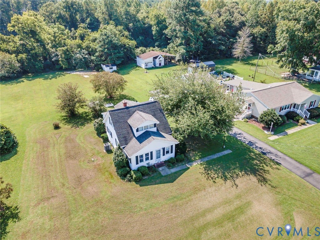 4912 Water View Road, Water View, Jamaica, VA 23180 Expansive property with a white two-story residence featuring a dormer window and dark-shingled roof