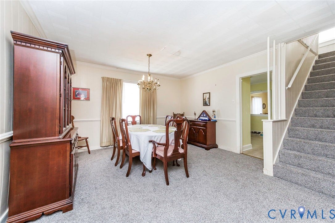 4912 Water View Road, Water View, Jamaica, VA 23180 Carpeted flooring, chair rail molding, and a chandelier lighting fixture