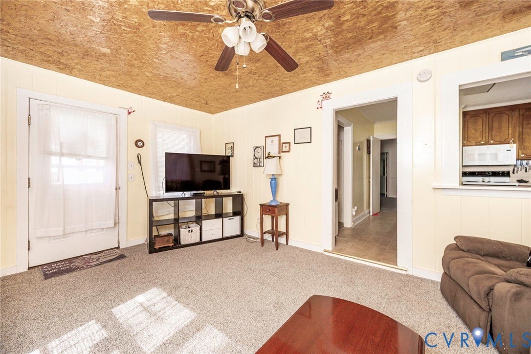 4912 Water View Road, Water View, Jamaica, VA 23180 Recessed pass-through opening to the kitchen, new carpet flooring, and a ceiling fan with integrated lighting