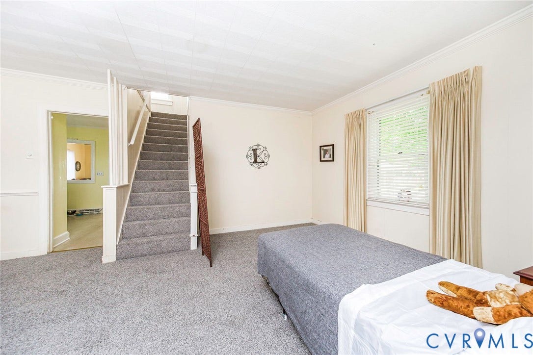 4912 Water View Road, Water View, Jamaica, VA 23180 Carpeted flooring, window with blinds, and staircase with carpeted treads