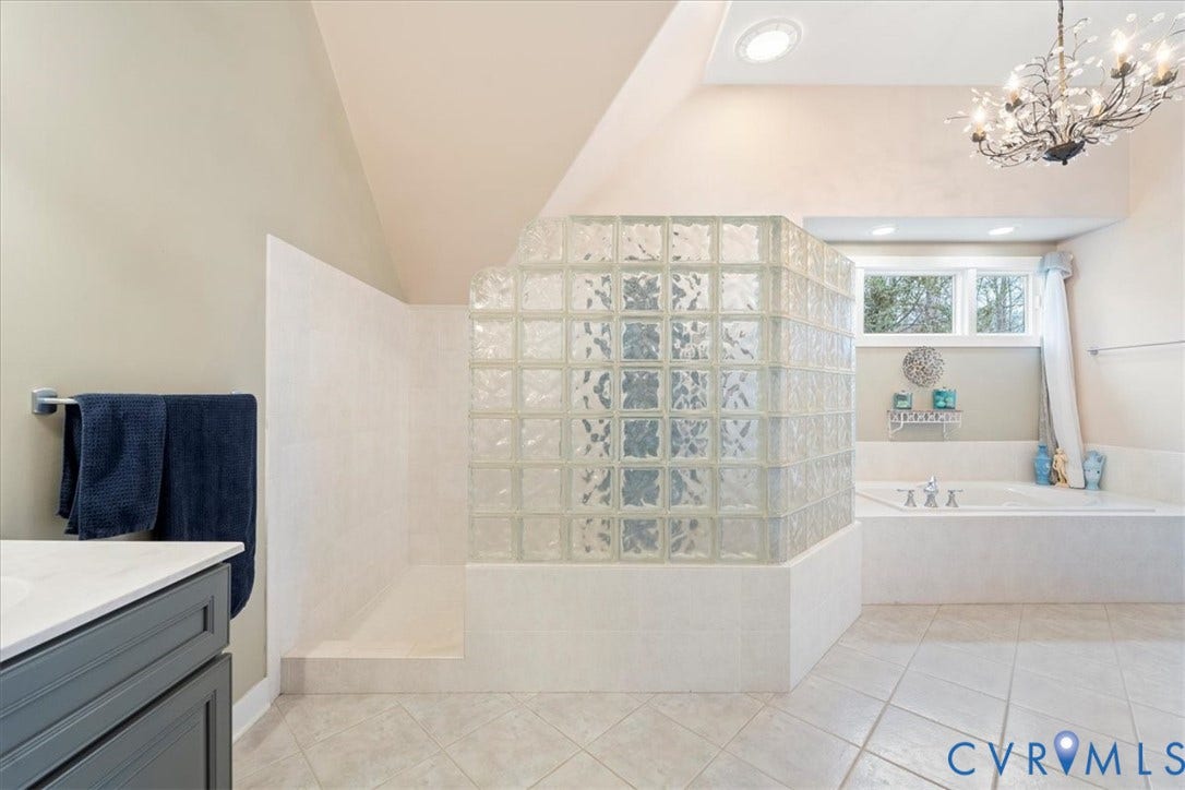 8908 Thomas Higgs Court, Toano, VA 23168 Glass block shower enclosure, built-in soaking tub, dual windows, and recessed lighting