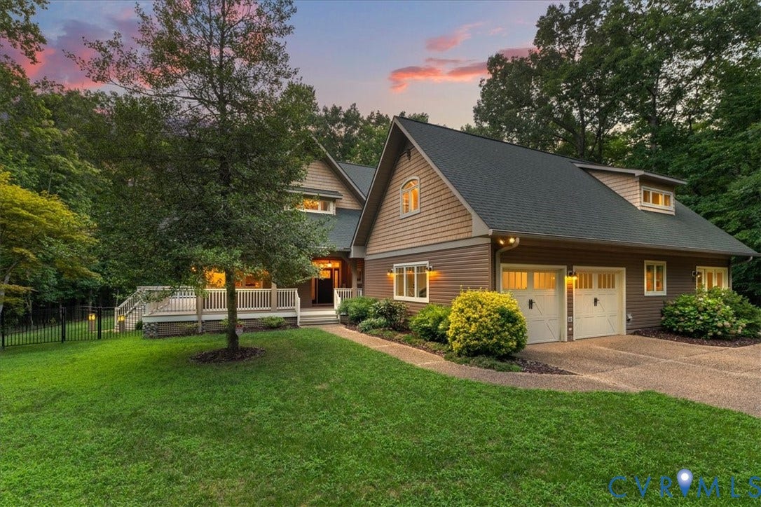 8908 Thomas Higgs Court, Toano, VA 23168 Multi-level exterior deck with a screened porch, lattice skirting, and stone column accents