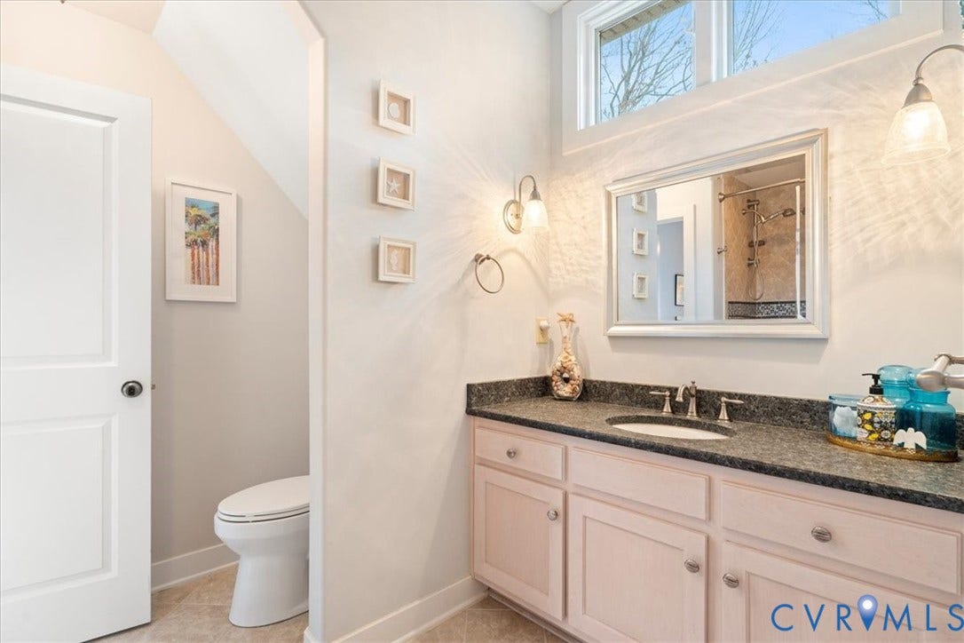 8908 Thomas Higgs Court, Toano, VA 23168 Single vanity with a dark countertop and integrated sink