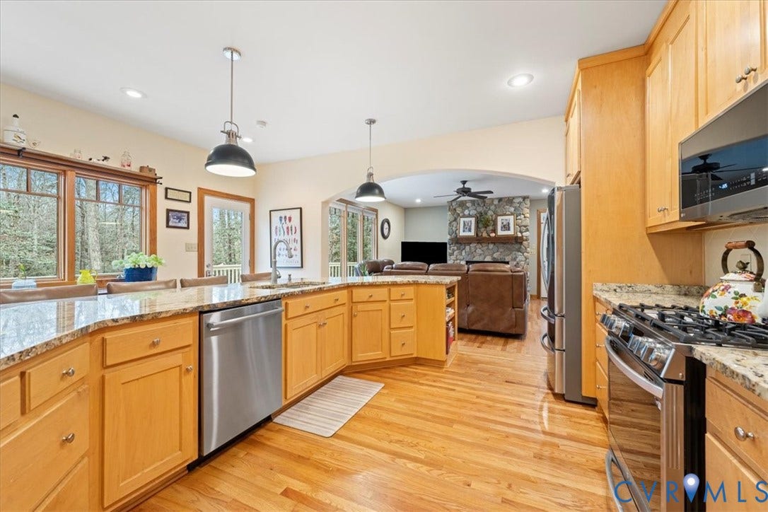 8908 Thomas Higgs Court, Toano, VA 23168 Kitchen with hardwood-finish flooring, light wood cabinetry, granite-finish countertops, and stainless steel appliances