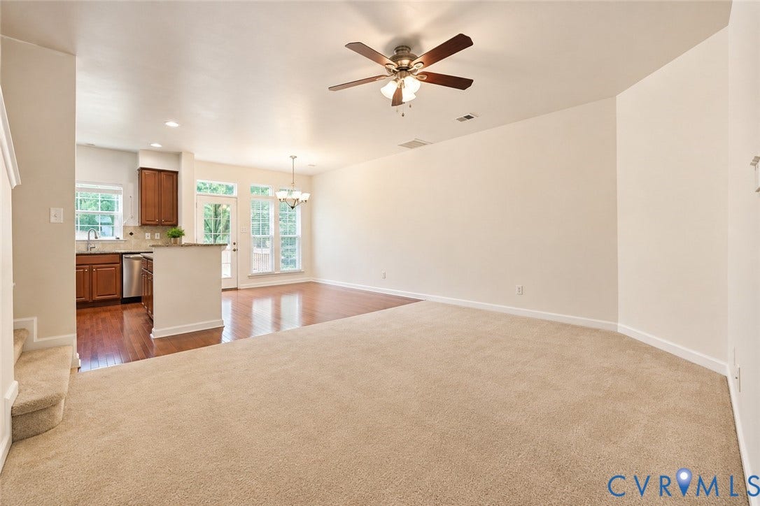 Open-concept design featuring wood-finish flooring, a ceiling fan, and recessed lighting