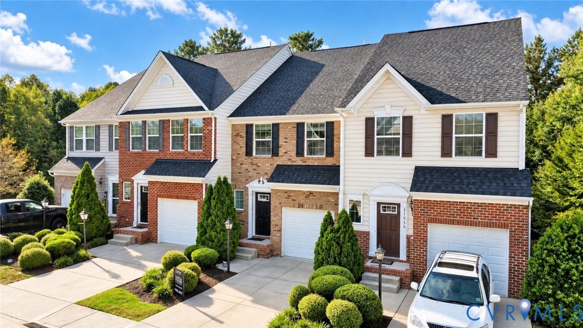 Brick and siding exterior with multiple gables and dormers