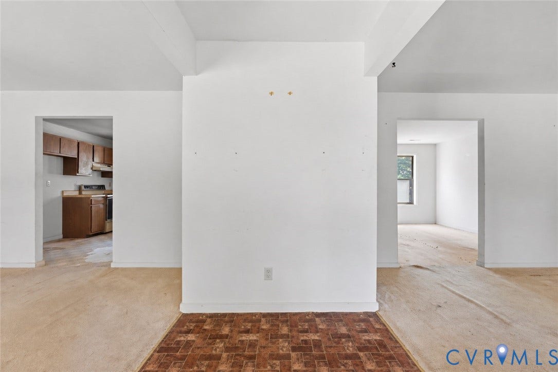 Entry with two spacious rooms to either side.