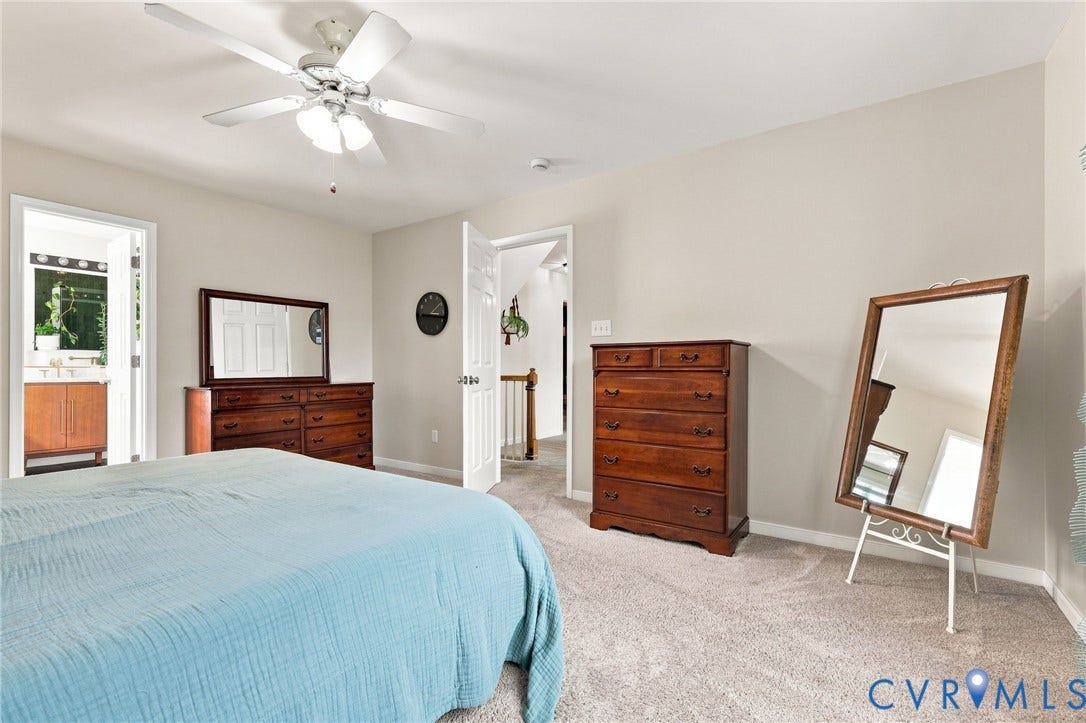 11342 McCauliff Court, North Chesterfield, VA 23236 Recessed lighting, ceiling fan with light fixture, neutral wall color, carpet flooring, and a doorway opening to a bathroom with a wood-finish vanity