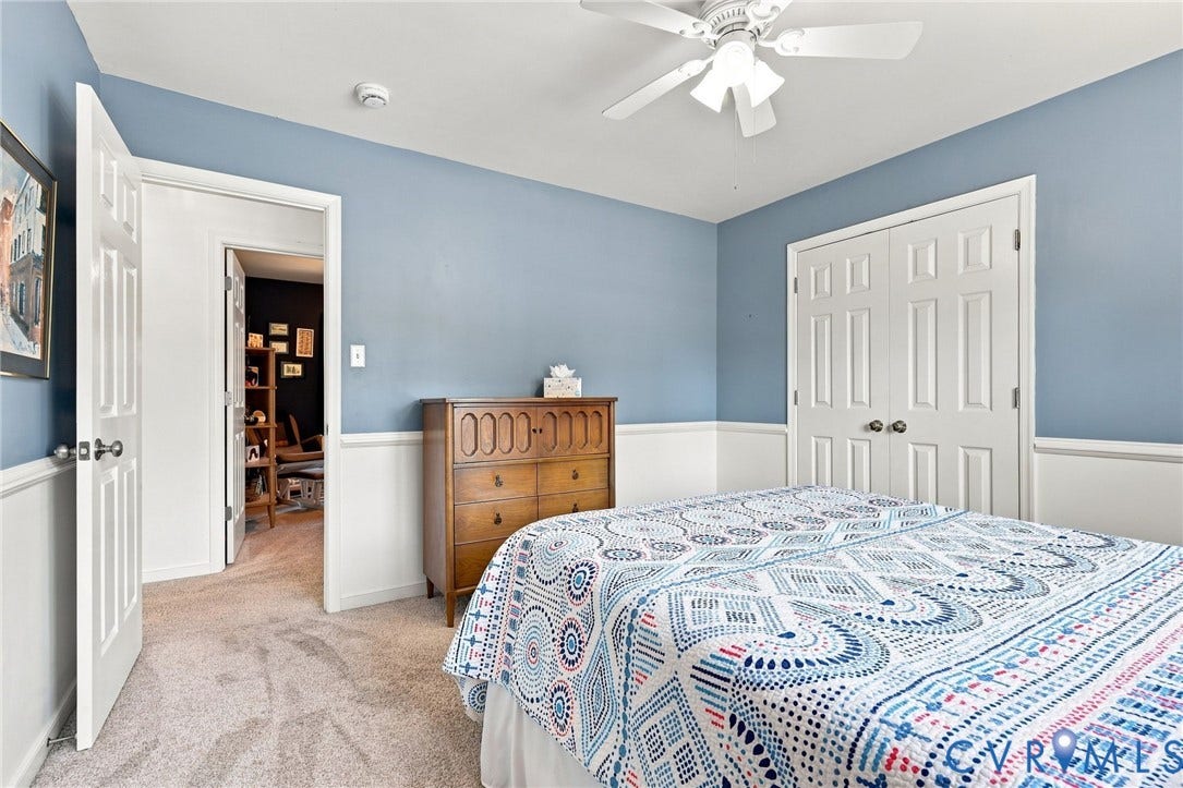 11342 McCauliff Court, North Chesterfield, VA 23236 Bedroom #3 w/ Wall-to-wall carpeting with blue painted walls, white wainscoting, and a white ceiling fan