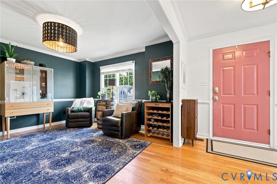 11342 McCauliff Court, North Chesterfield, VA 23236 Hardwood flooring, painted interior door, decorative ceiling light fixture, crown molding, and a built-in window