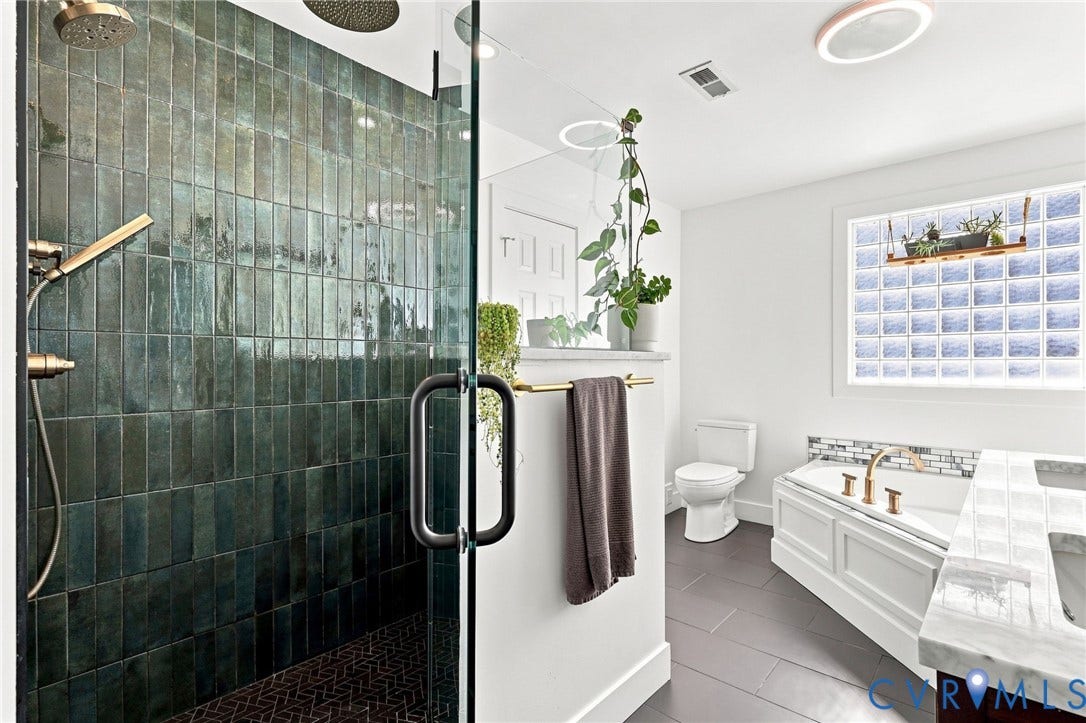 11342 McCauliff Court, North Chesterfield, VA 23236 Walk-in shower with dark tile surround and glass enclosure
