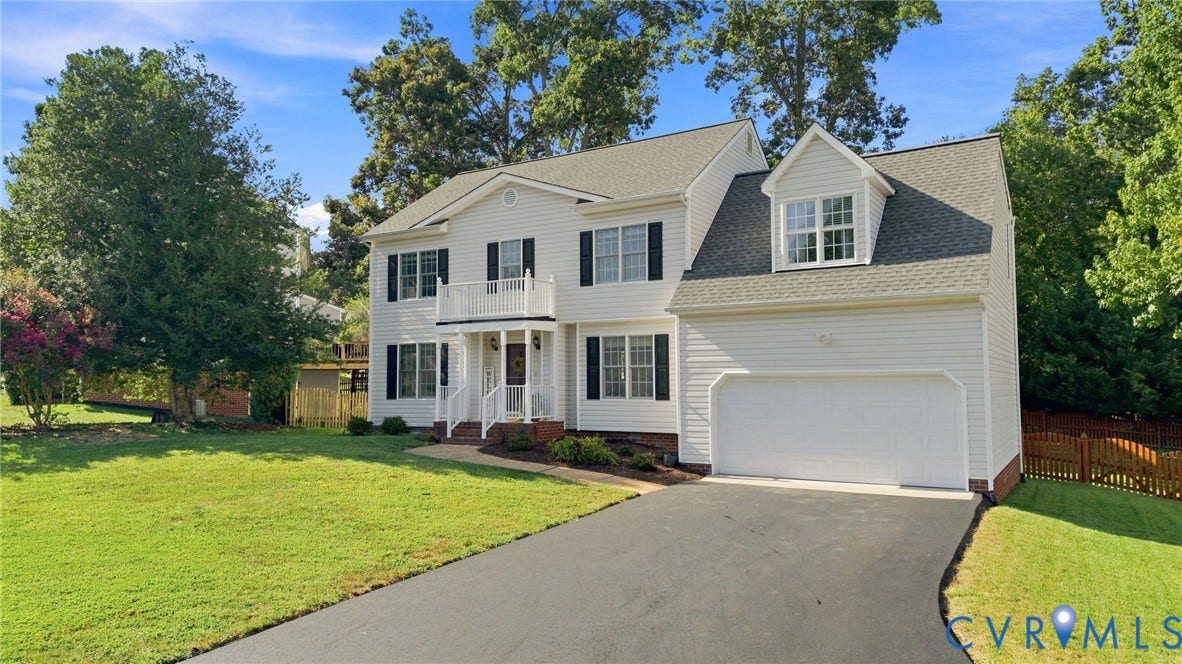 11342 McCauliff Court, North Chesterfield, VA 23236 Two-story residence featuring white siding, a two-car garage with a dormer, a full-width upper balcony, and a covered entry porch