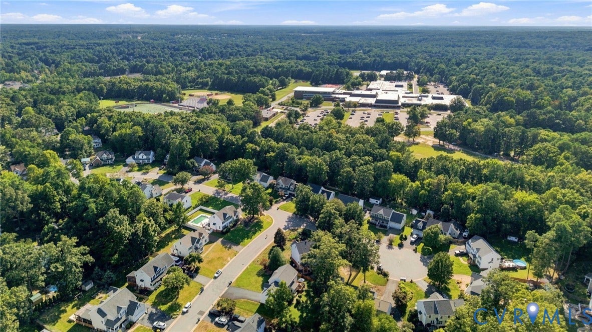 11342 McCauliff Court, North Chesterfield, VA 23236 Residential area with established trees and multiple properties featuring private swimming pools