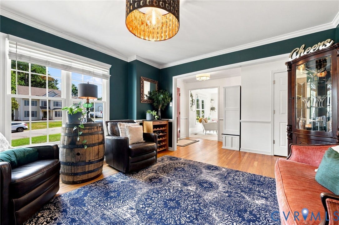 11342 McCauliff Court, North Chesterfield, VA 23236 Dinning Room w/ Hardwood flooring, decorative chandelier, crown molding, white trim, and a built-in wine rack