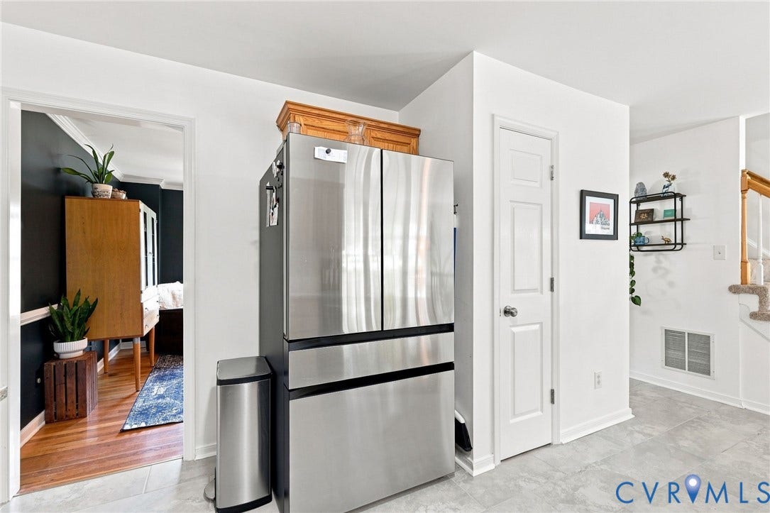 11342 McCauliff Court, North Chesterfield, VA 23236 Stainless steel French door refrigerator, white paneled interior door, and light-toned flooring