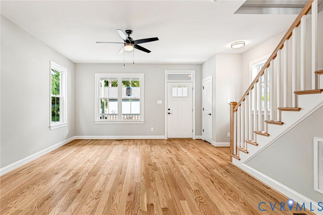 310 E 33rd Street, Swansboro West, Richmond, VA 23224 Hardwood flooring, painted white walls, white trim, recessed lighting, and a ceiling fan