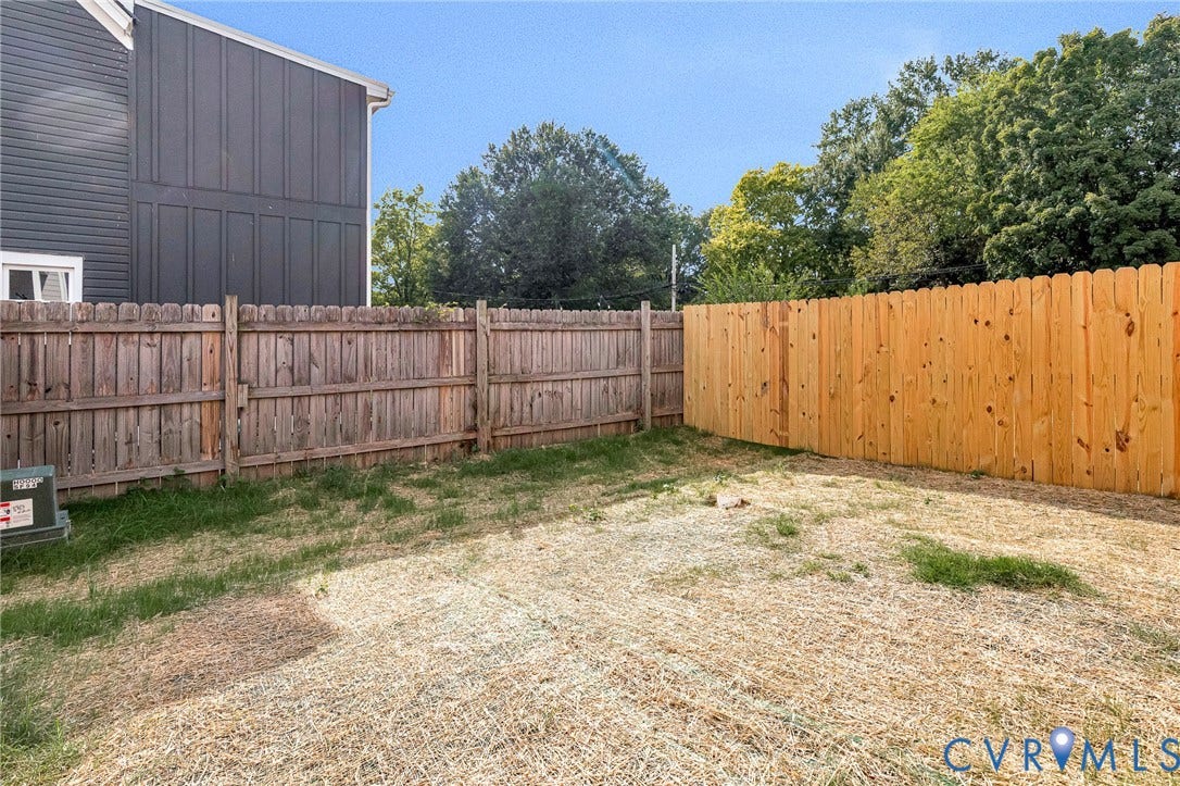 310 E 33rd Street, Swansboro West, Richmond, VA 23224 Fenced backyard with a blend of weathered and new wood fencing