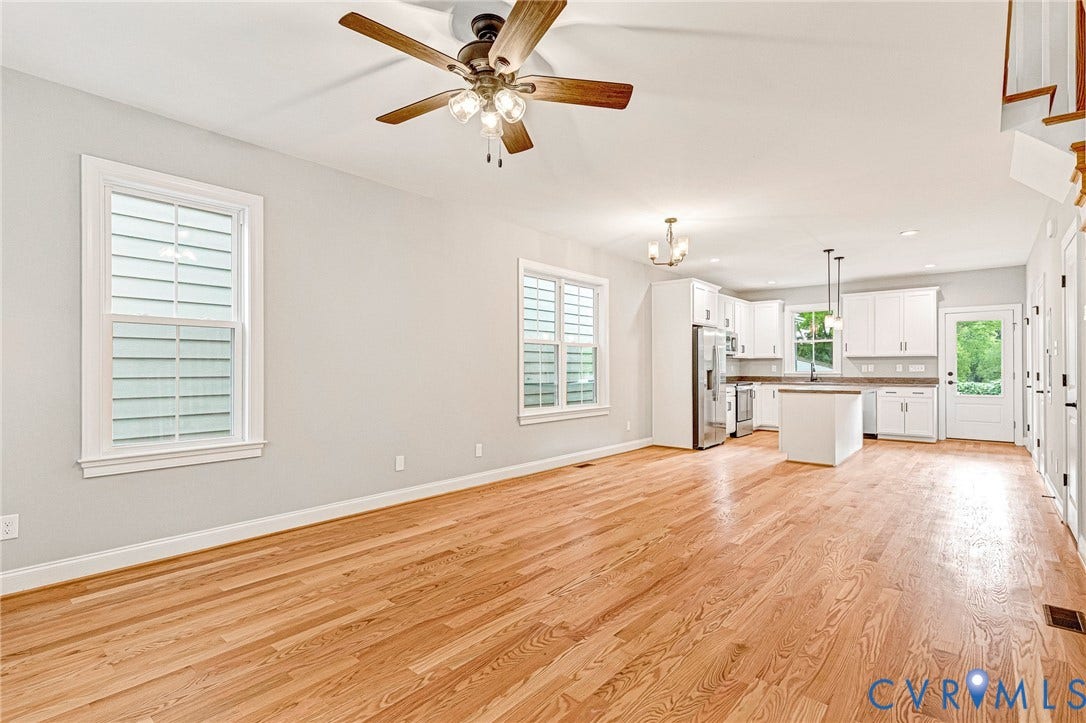 308 E 33rd Street, Swansboro West, Richmond, VA 23224 Hardwood flooring throughout, a ceiling fan with light fixture, and white window shutters