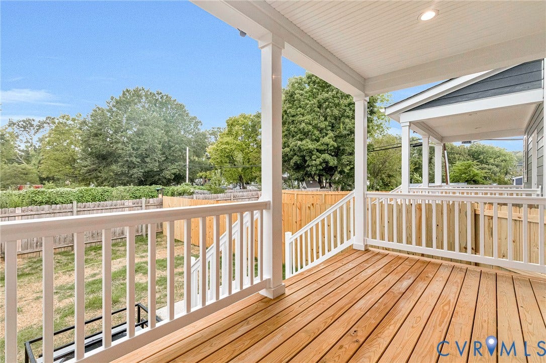308 E 33rd Street, Swansboro West, Richmond, VA 23224 Expansive rear deck featuring natural wood decking, white railings, and recessed lighting in the covered ceiling