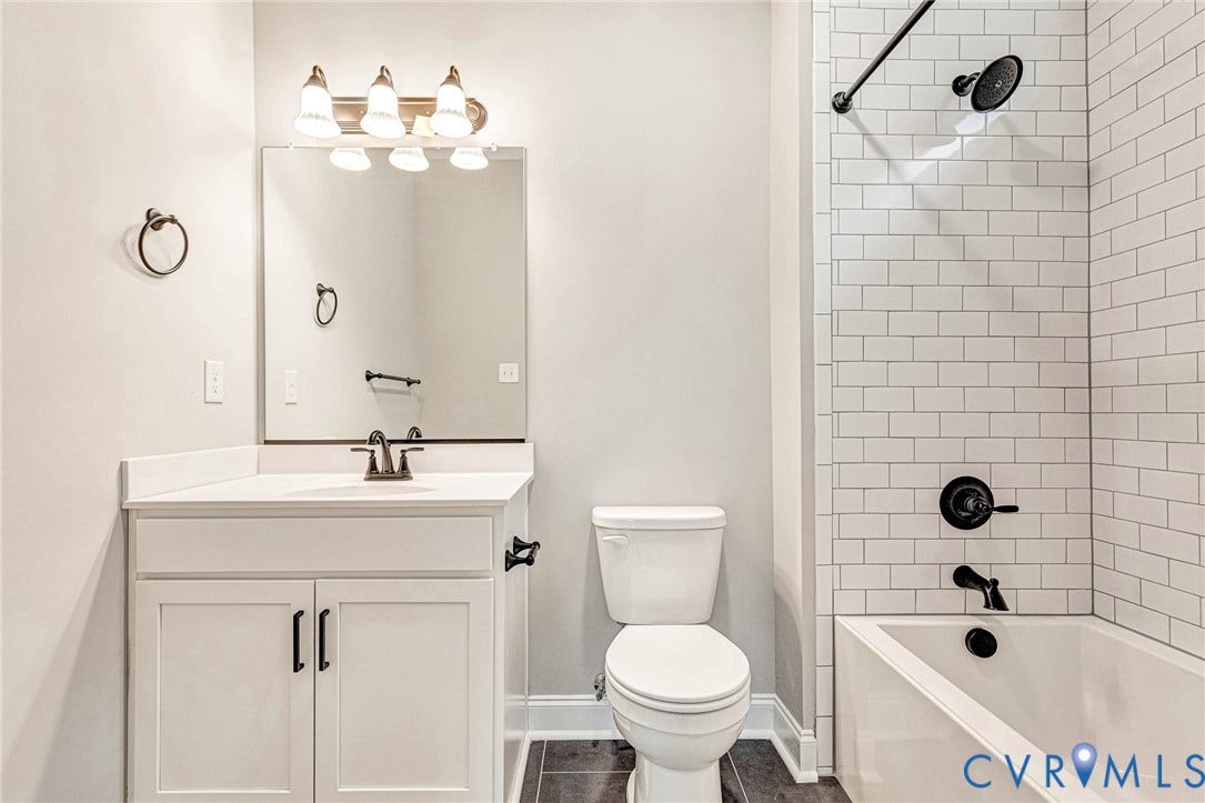 308 E 33rd Street, Swansboro West, Richmond, VA 23224 White subway tile shower surround with matte black fixtures