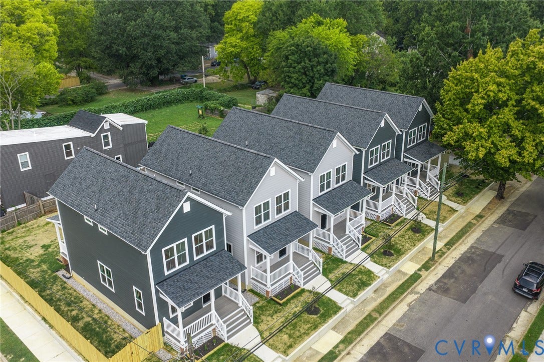 308 E 33rd Street, Swansboro West, Richmond, VA 23224 Modern construction with dark gray siding, white trim, and covered front porches