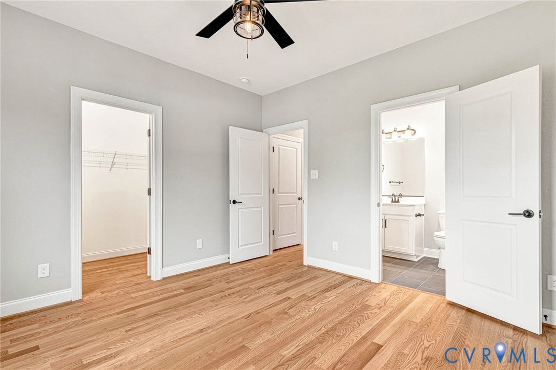 308 E 33rd Street, Swansboro West, Richmond, VA 23224 Hardwood flooring, light gray walls, ceiling fan, and white doors with dark hardware