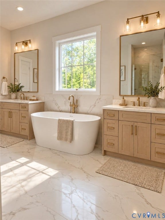 2695 High Bank Place, Powhatan, VA 23139 Freestanding soaking tub, dual wood-finish vanities with undermount sinks, bronze hardware, and large format tile flooring