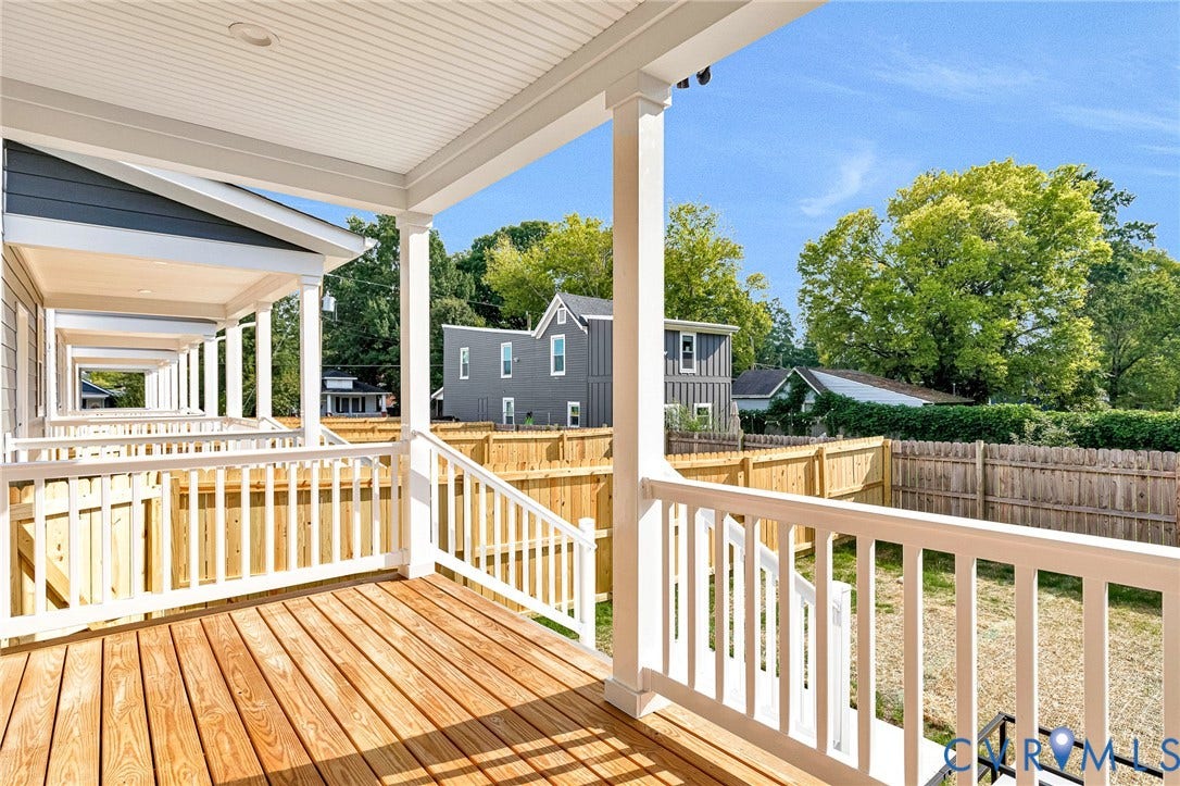 306 E 33rd Street, Swansboro West, Richmond, VA 23224 Expansive covered deck featuring white composite railings, wood-finish decking, and white support columns
