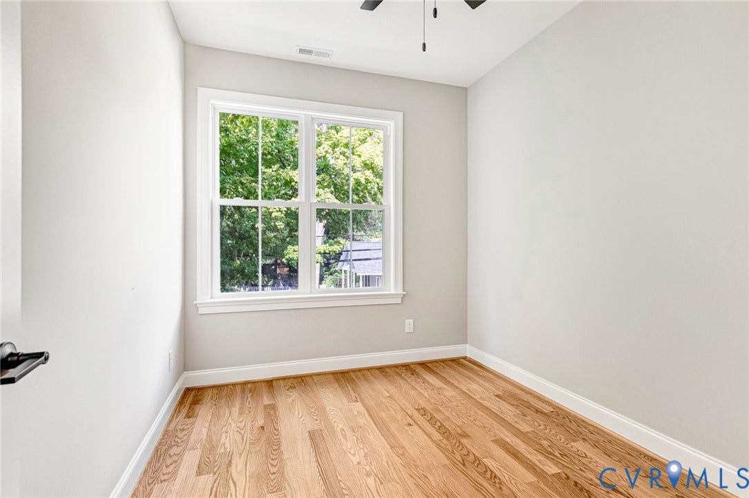 306 E 33rd Street, Swansboro West, Richmond, VA 23224 Hardwood flooring, painted walls, white trim, double-hung windows, and a ceiling fan