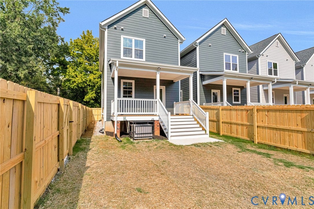 306 E 33rd Street, Swansboro West, Richmond, VA 23224 Rear exterior featuring a covered porch, white railing, and steps to grade