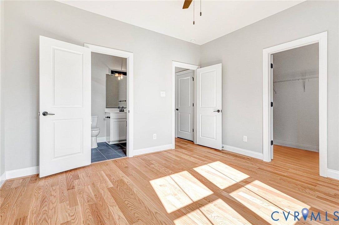 306 E 33rd Street, Swansboro West, Richmond, VA 23224 Hardwood flooring, light gray wall finishes, white trim, ceiling fan, and access to a full bathroom