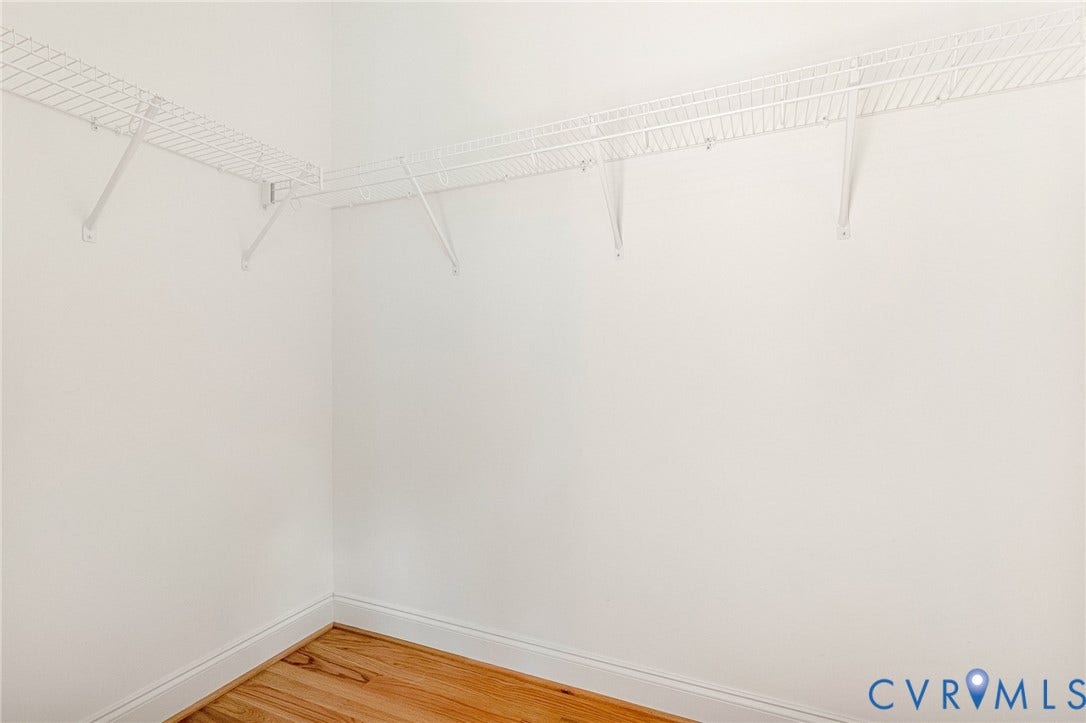 306 E 33rd Street, Swansboro West, Richmond, VA 23224 Corner closet featuring wire shelving and wood-finish flooring