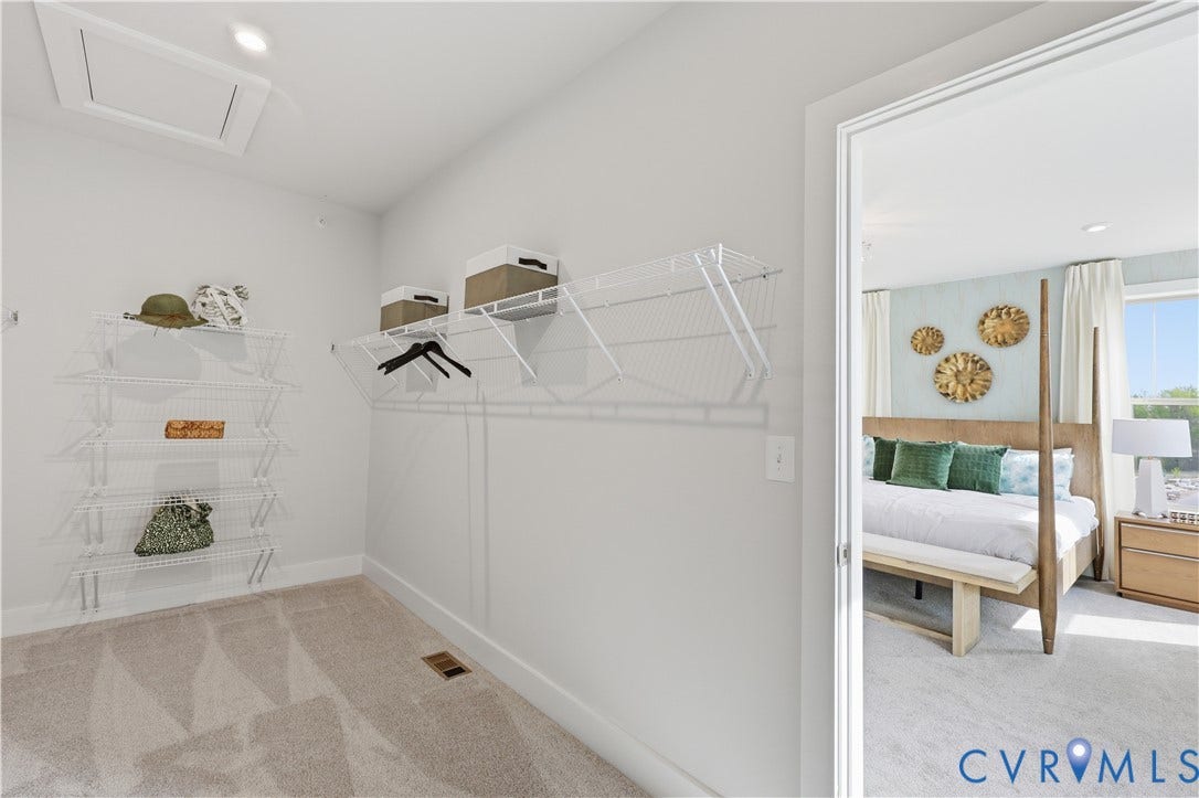 3627 Edna Path, #B, Gayton Village, Henrico, VA 23233 Carpeted walk-in closet featuring wire shelving, hanging rods, and a ceiling-mounted light fixture