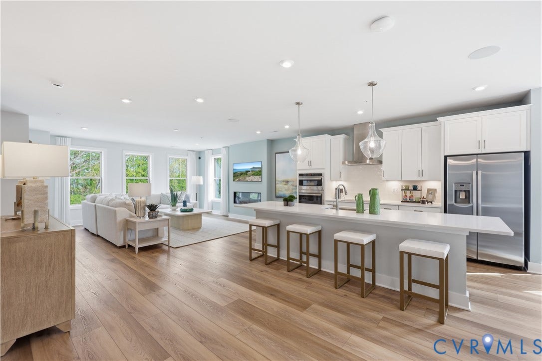 3627 Edna Path, #B, Gayton Village, Henrico, VA 23233 Open-concept living area featuring light wood-finish flooring, recessed lighting, and a contemporary kitchen with white cabinetry