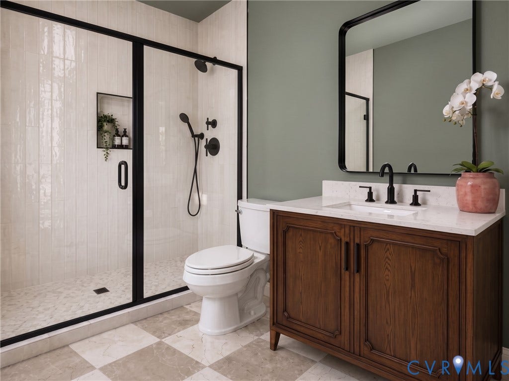 5416 Blueridge Avenue, Richmond, VA 23231 Walk-in shower with black-framed glass enclosure, built-in shelving, and matte black fixtures