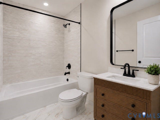 5416 Blueridge Avenue, Richmond, VA 23231 White bathtub with matte black fixtures, light-toned textured shower surround, wood-finish vanity with drawer storage, white countertop with integrated sink, and a black-framed mirror