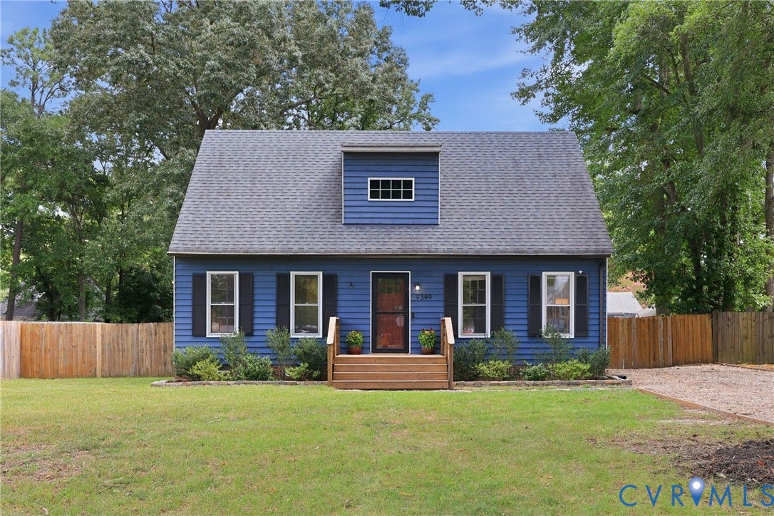 9349 Shiloh Drive, Chesterfield, VA 23237 Blue siding exterior with black shutters, a gabled roof, and a dormer window