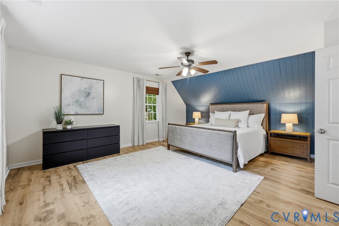 9349 Shiloh Drive, Chesterfield, VA 23237 Wood-finish flooring, accent wall with vertical paneling, window with blinds, and ceiling fan