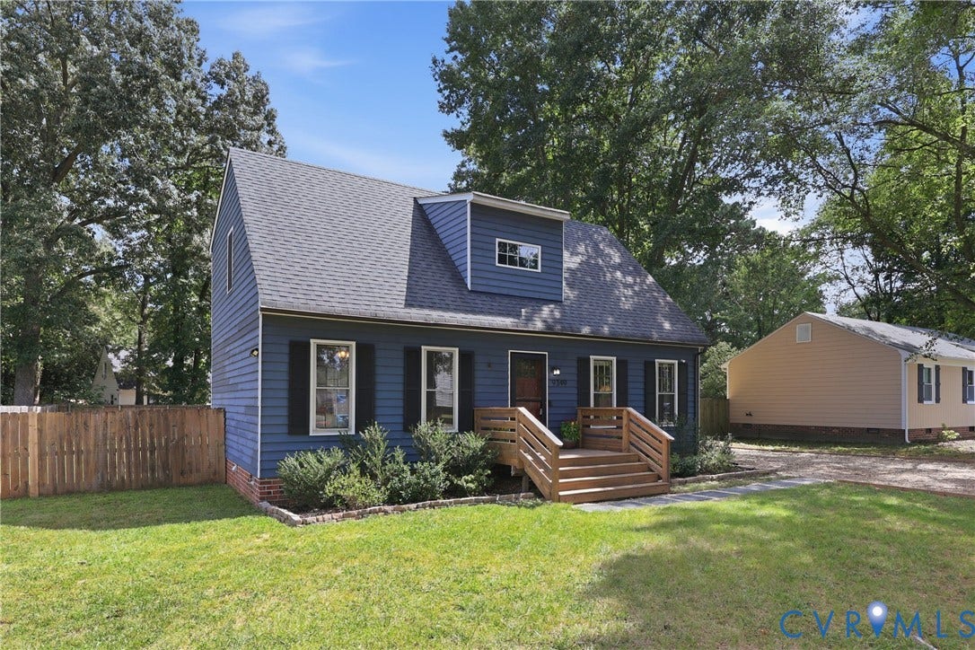 9349 Shiloh Drive, Chesterfield, VA 23237 Blue siding exterior with dormer window, black louvered shutters, light wood-tone steps, and a fenced side yard