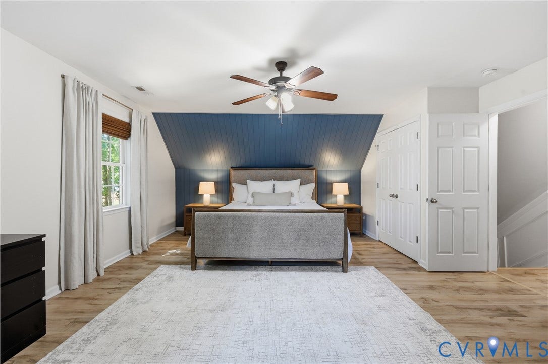9349 Shiloh Drive, Chesterfield, VA 23237 Wood-finish flooring throughout, complemented by a white ceiling fan with wood-finish blades