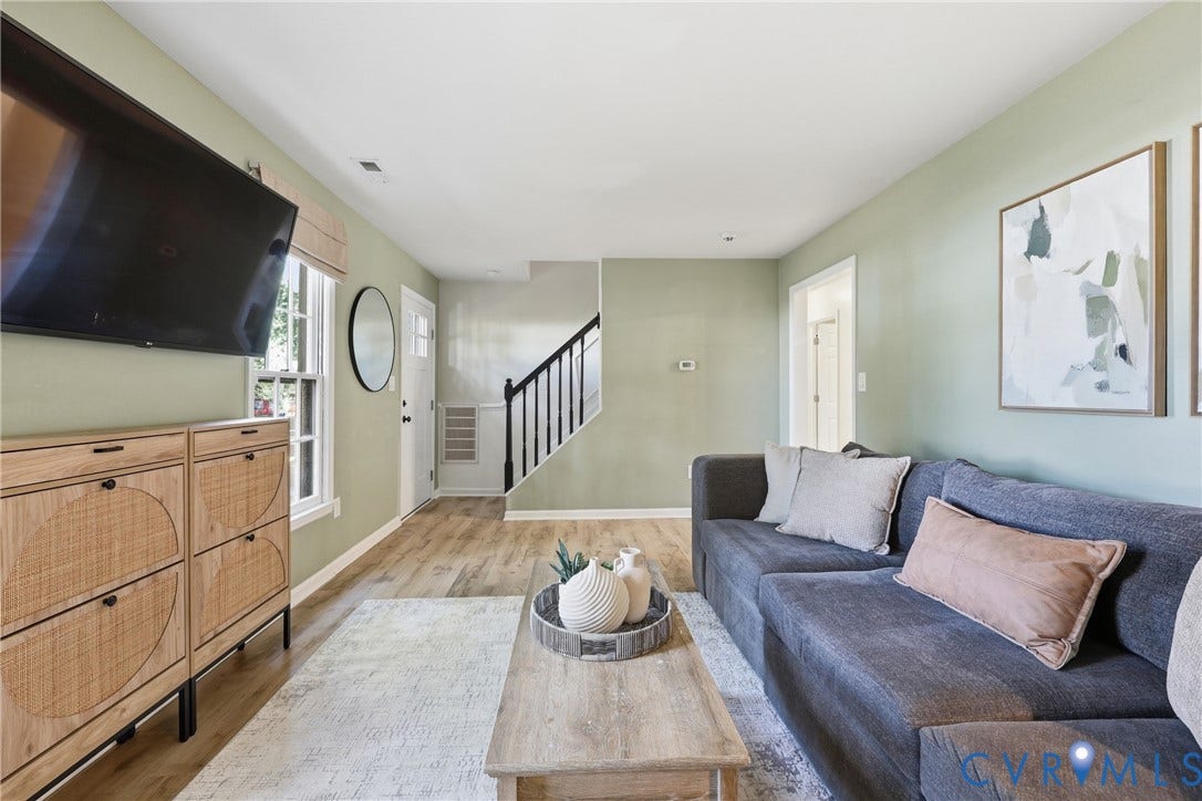 9349 Shiloh Drive, Chesterfield, VA 23237 Wood-finish flooring, staircase with dark railing, white trim, recessed lighting, and light-colored walls