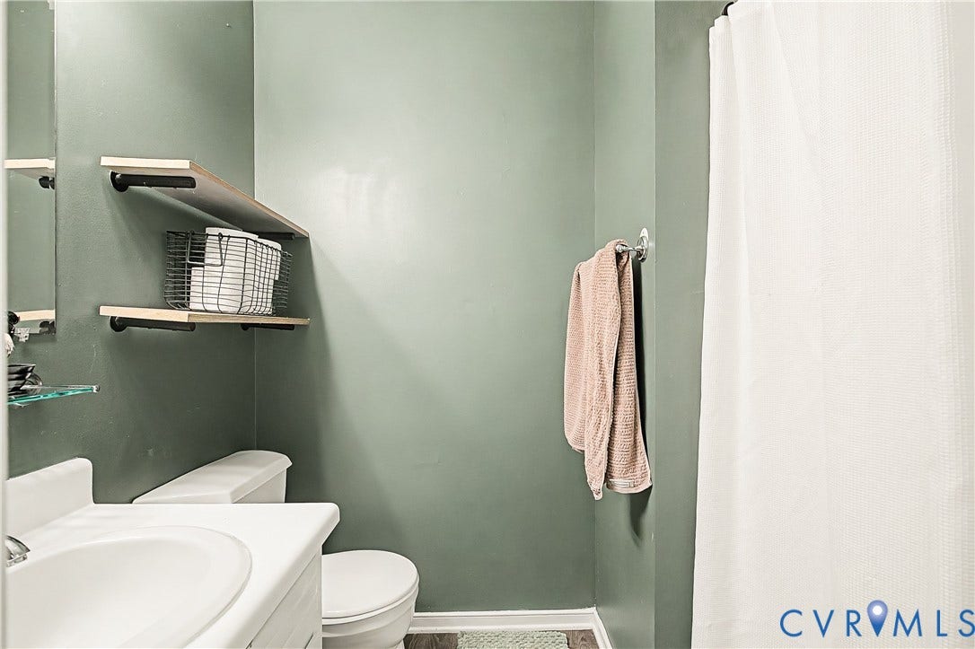 1506 Porters Mill Terrace, Smoketree South, Midlothian, VA 23114 White toilet and sink with a white vanity